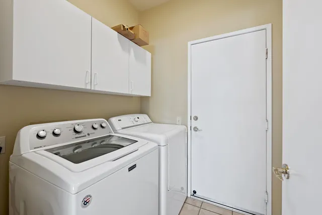 a view of a chairs and table in patio