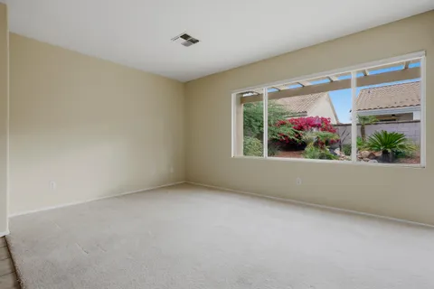 a bathroom with a sink vanity granite shower and a mirror