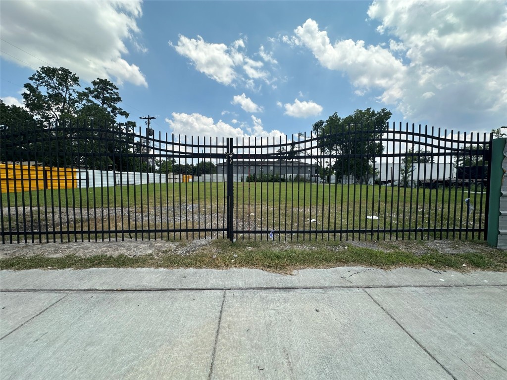 a view of a wrought iron fences in front of house