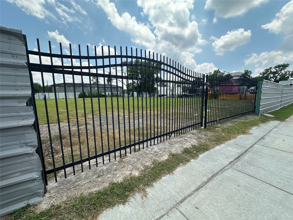 6514 Laura Koppe Road Houston, TX 77016 - Photo 6 of 6 a view of a backyard with iron fence