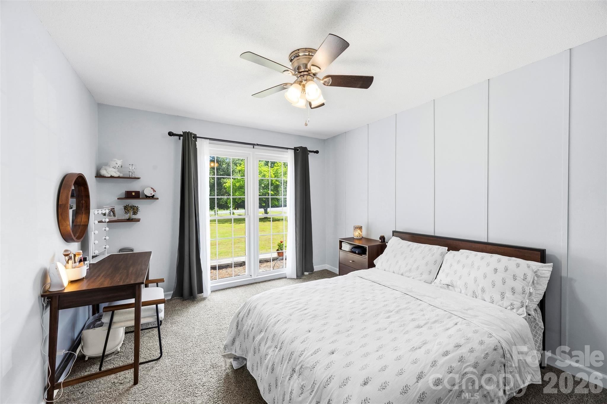 10919 Harrisburg Road Fort Mill, SC 29707 - Photo 23 of 43 a bedroom with a bed and a chandelier