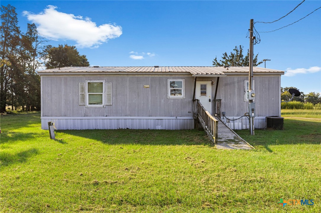 252 Lcr 421 Groesbeck, TX 76642 - Photo 13 of 16 a view of a house with backyard tub and fire pit
