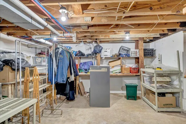 a view of a room with wooden floor and white walls