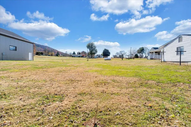 a view of house with yard