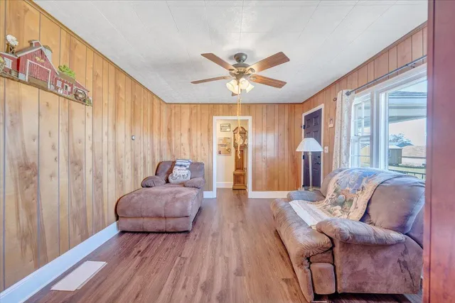 a living room with a couch and a chandelier