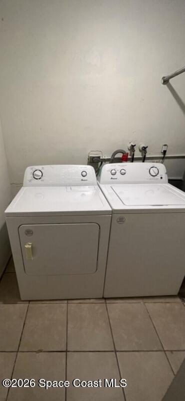 2964 Garden Terrace Northeast Palm Bay, FL 32905 - Photo 3 of 6 a utility room with a sink washer and dryer
