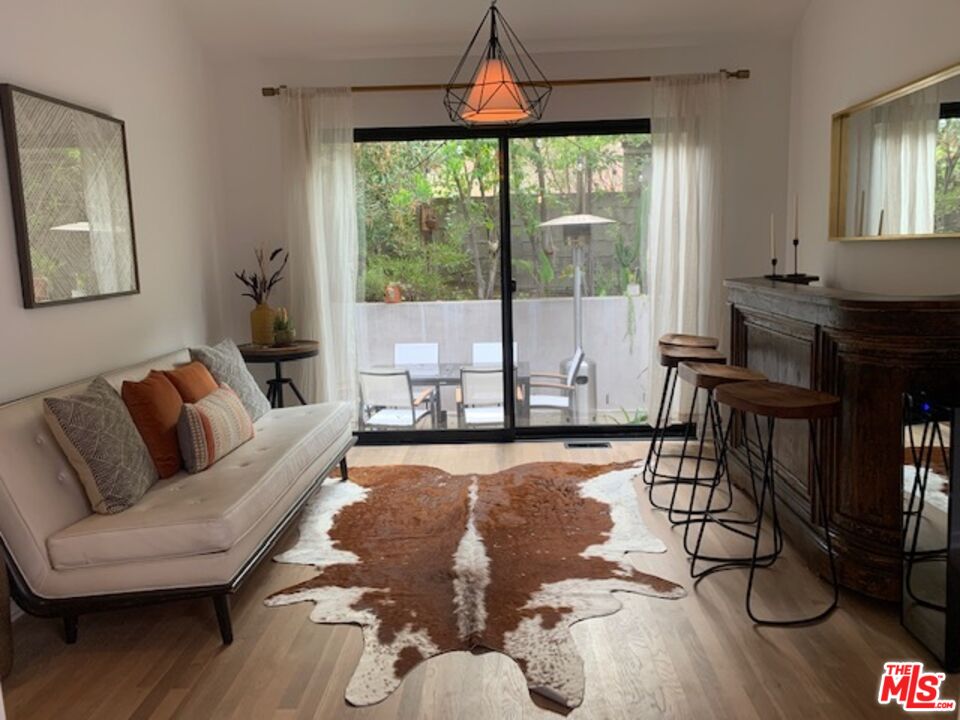 25761 Vista Verde Drive Calabasas, CA 91302 - Photo 11 of 22 a living room with furniture and a large window