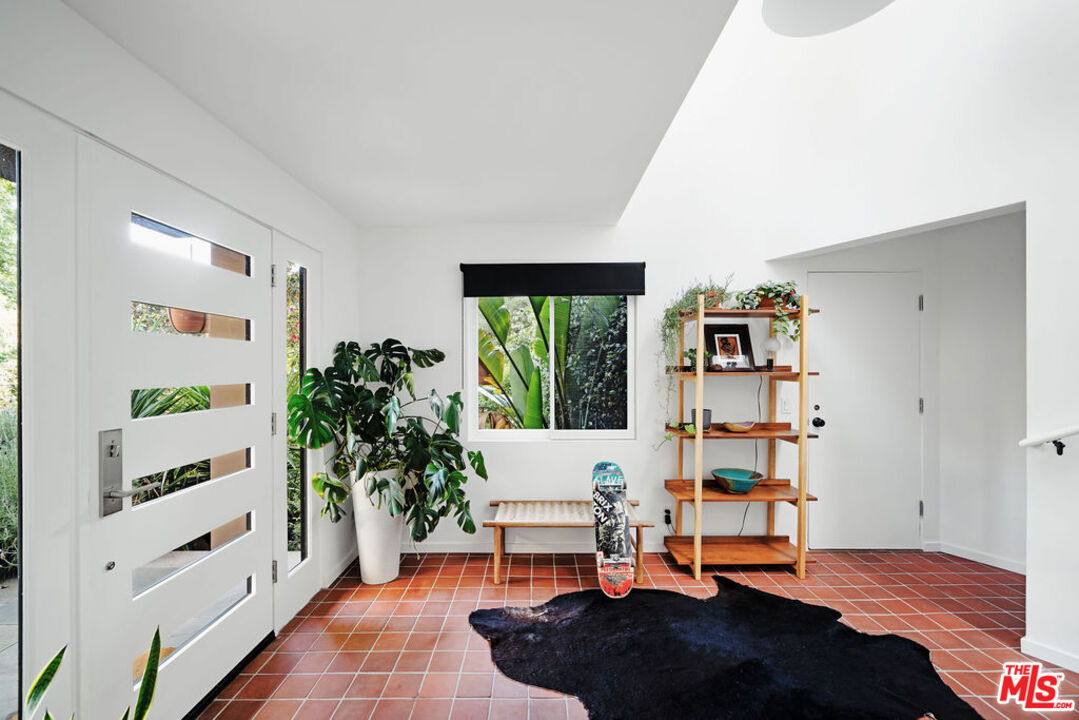25761 Vista Verde Drive Calabasas, CA 91302 - Photo 3 of 22 a living room with furniture and a potted plant