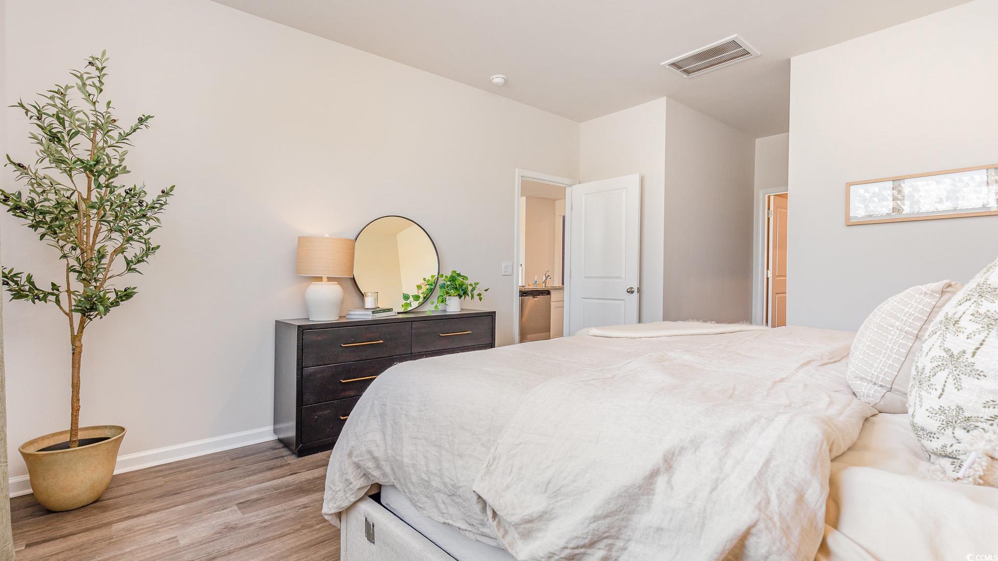 592 Duvall Street Longs, SC 29568 - Photo 15 of 28 Bedroom with baseboards and light wood-style flooring