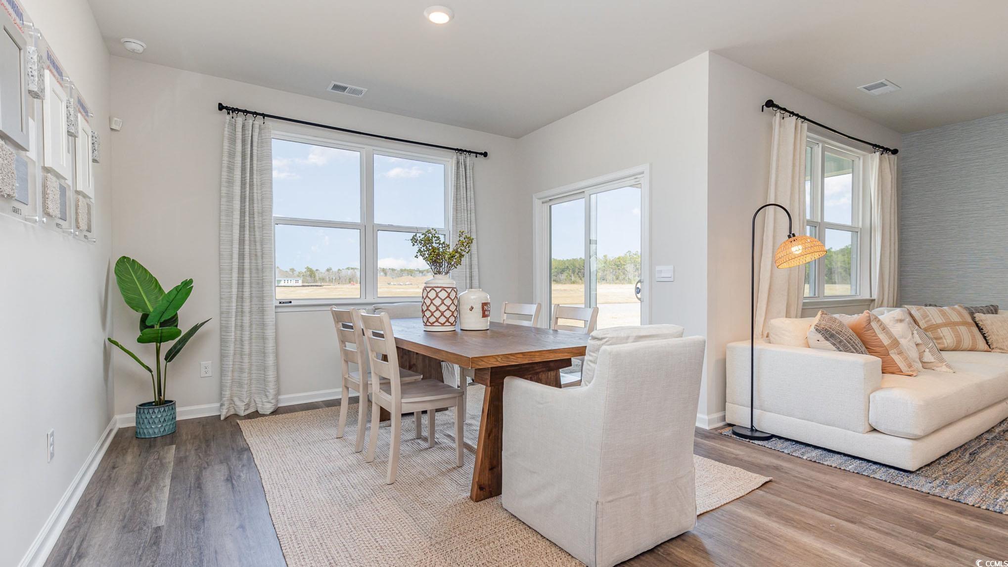 592 Duvall Street Longs, SC 29568 - Photo 7 of 28 Dining room with wood finished floors and recessed lighting