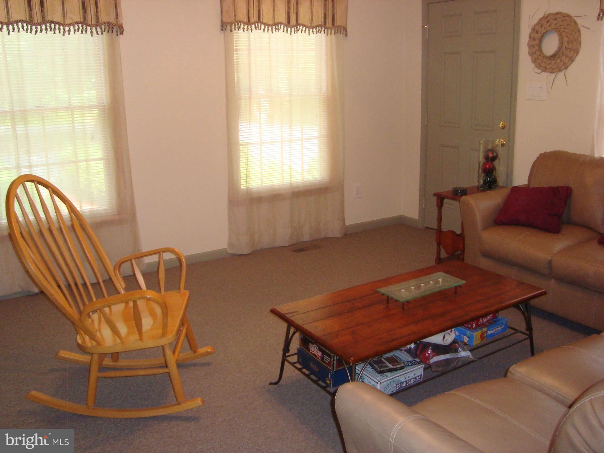 1901 Wilson Road White Hall, MD 21161 - Photo 15 of 26 a living room with furniture a rug and a window