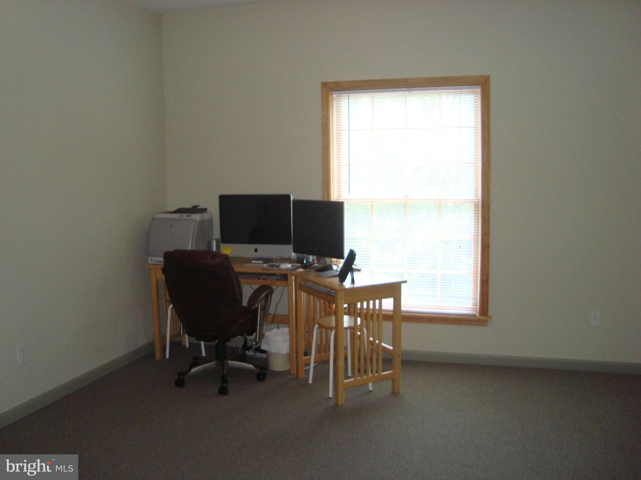 1901 Wilson Road White Hall, MD 21161 - Photo 16 of 26 a view of a workspace with furniture and a window