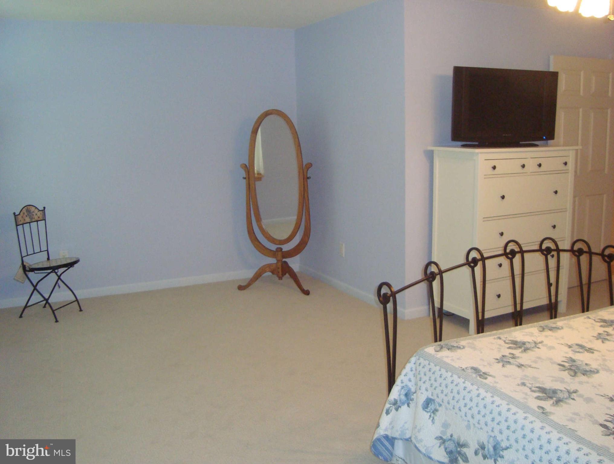 1901 Wilson Road White Hall, MD 21161 - Photo 19 of 26 a bedroom with a bed and a flat screen tv