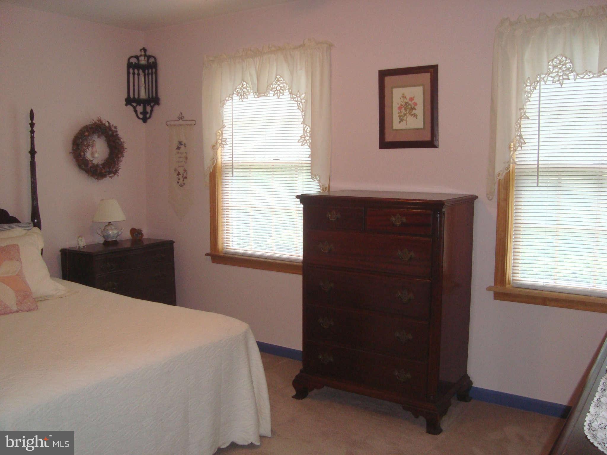 1901 Wilson Road White Hall, MD 21161 - Photo 21 of 26 a bedroom with a bed and a window