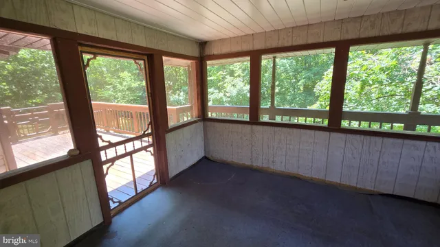 a view of an empty room with a large window
