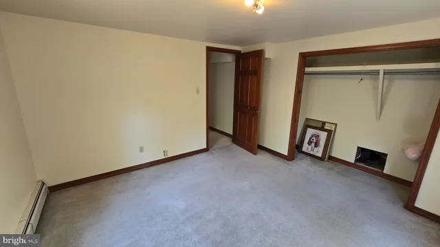 a view of a hallway with closet area