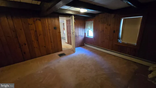 a bathroom with a bathtub and shower