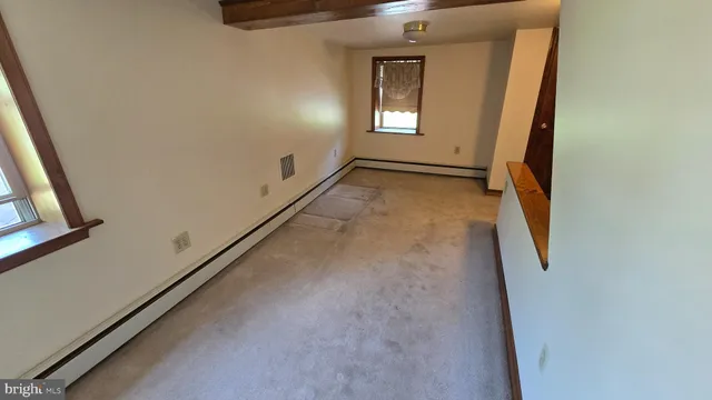 a couple of cars parked in front of a house