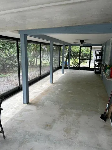 a view of a livingroom with an empty space and balcony