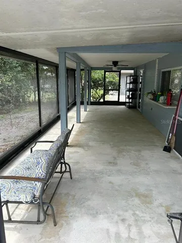 a view of a hallway with seating area