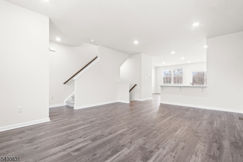 175 Mantoloking Drive Jackson, NJ 08527 - Photo 11 of 25 a view of an empty room with wooden floor and a window