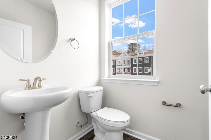 175 Mantoloking Drive Jackson, NJ 08527 - Photo 12 of 25 a bathroom with a toilet sink and mirror