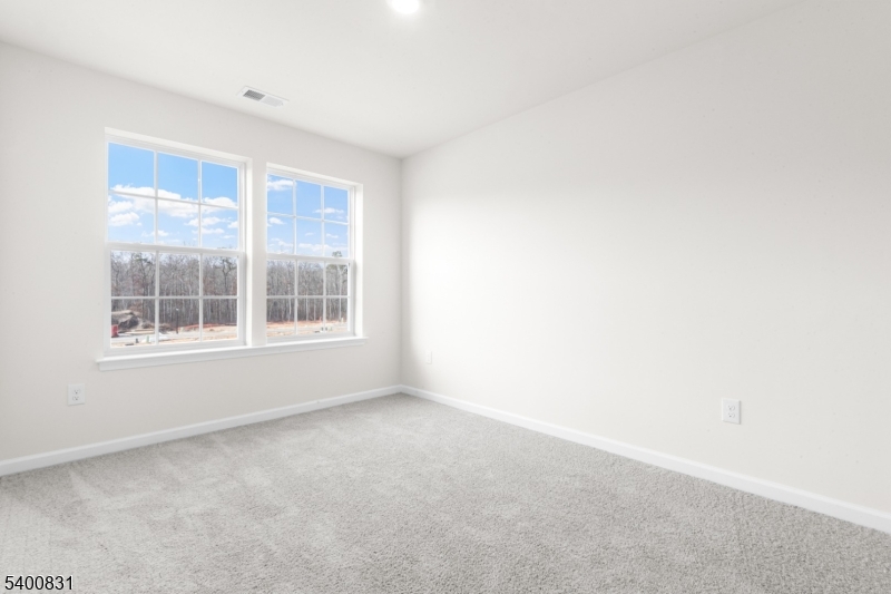 175 Mantoloking Drive Jackson, NJ 08527 - Photo 13 of 25 a view of an empty room with a window
