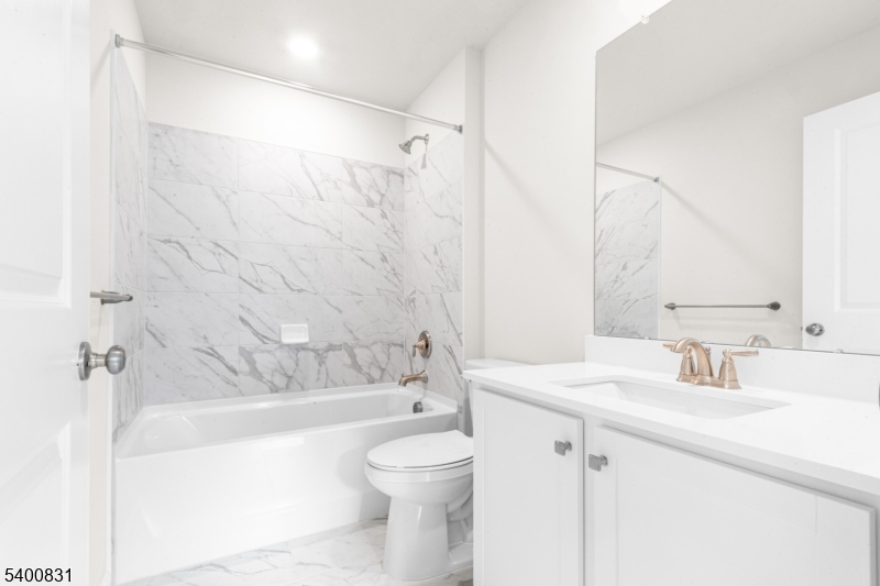 175 Mantoloking Drive Jackson, NJ 08527 - Photo 16 of 25 a bathroom with a sink a toilet and shower