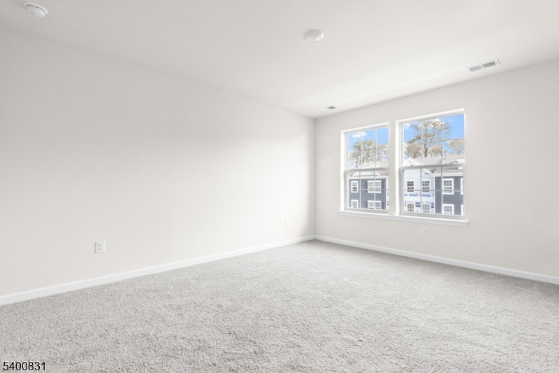 175 Mantoloking Drive Jackson, NJ 08527 - Photo 17 of 25 an empty room with windows