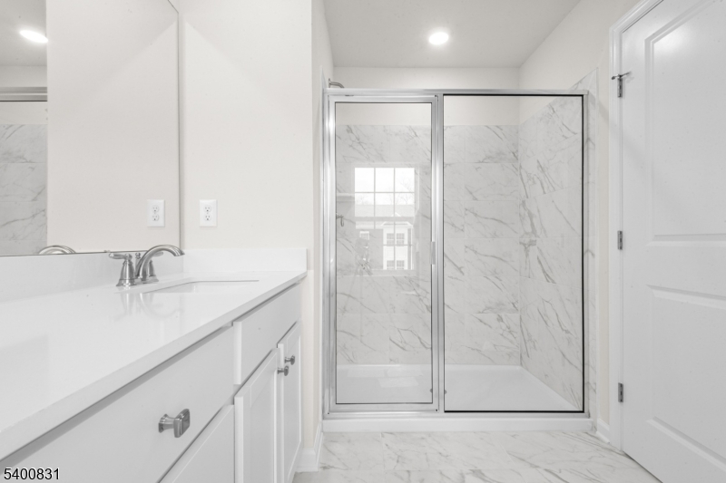 175 Mantoloking Drive Jackson, NJ 08527 - Photo 18 of 25 a bathroom with a granite countertop sink and a mirror