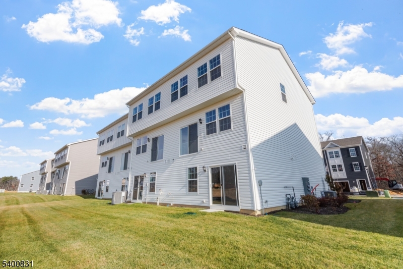 175 Mantoloking Drive Jackson, NJ 08527 - Photo 23 of 25 a big building next to a yard