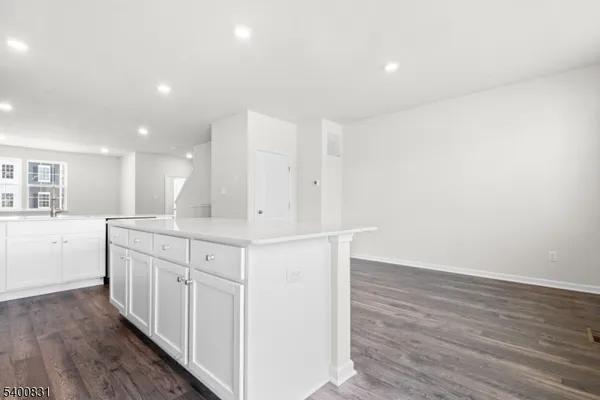 a kitchen with white cabinets