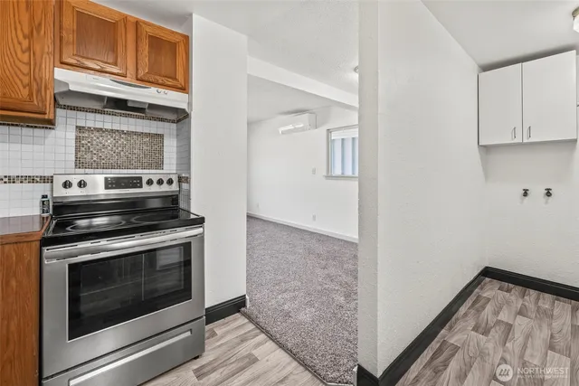 a kitchen with a stove and a microwave