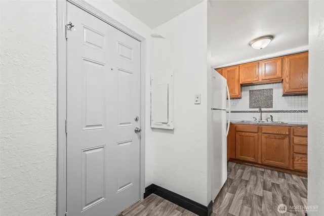 a room with a sink and a mirror