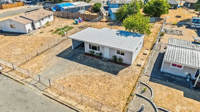 an aerial view of residential houses with outdoor space