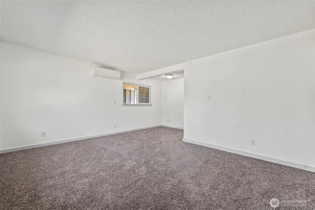 an empty room with a empty space and window