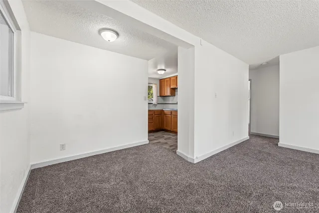 a view of a kitchen with refrigerator