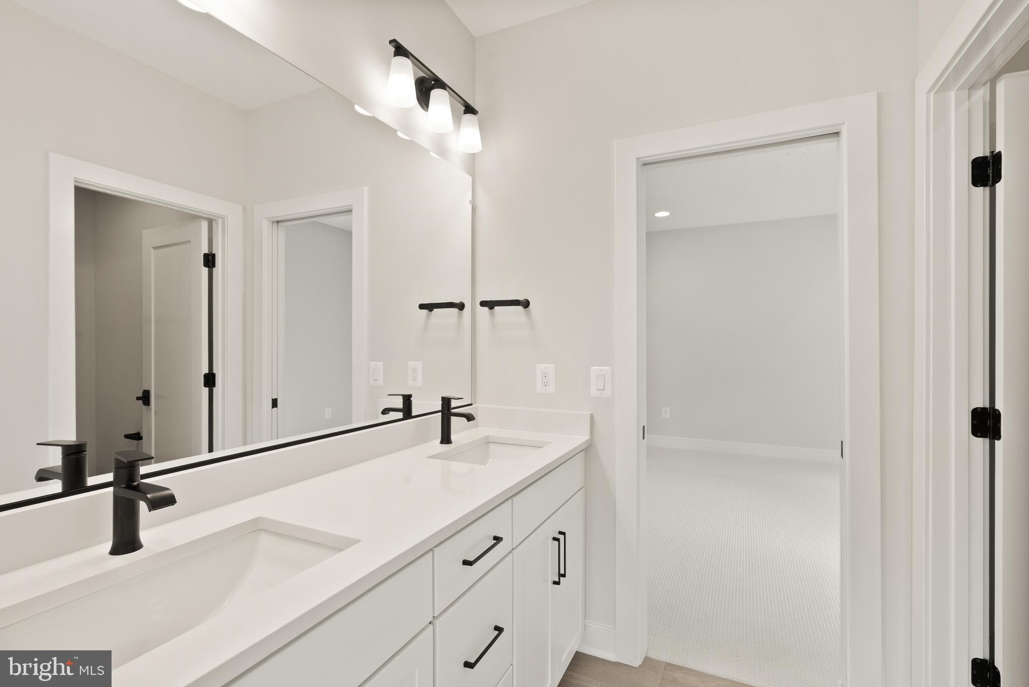 1212 Drake Street Southwest Vienna, VA 22180 - Photo 54 of 84 a bathroom with a sink and mirror