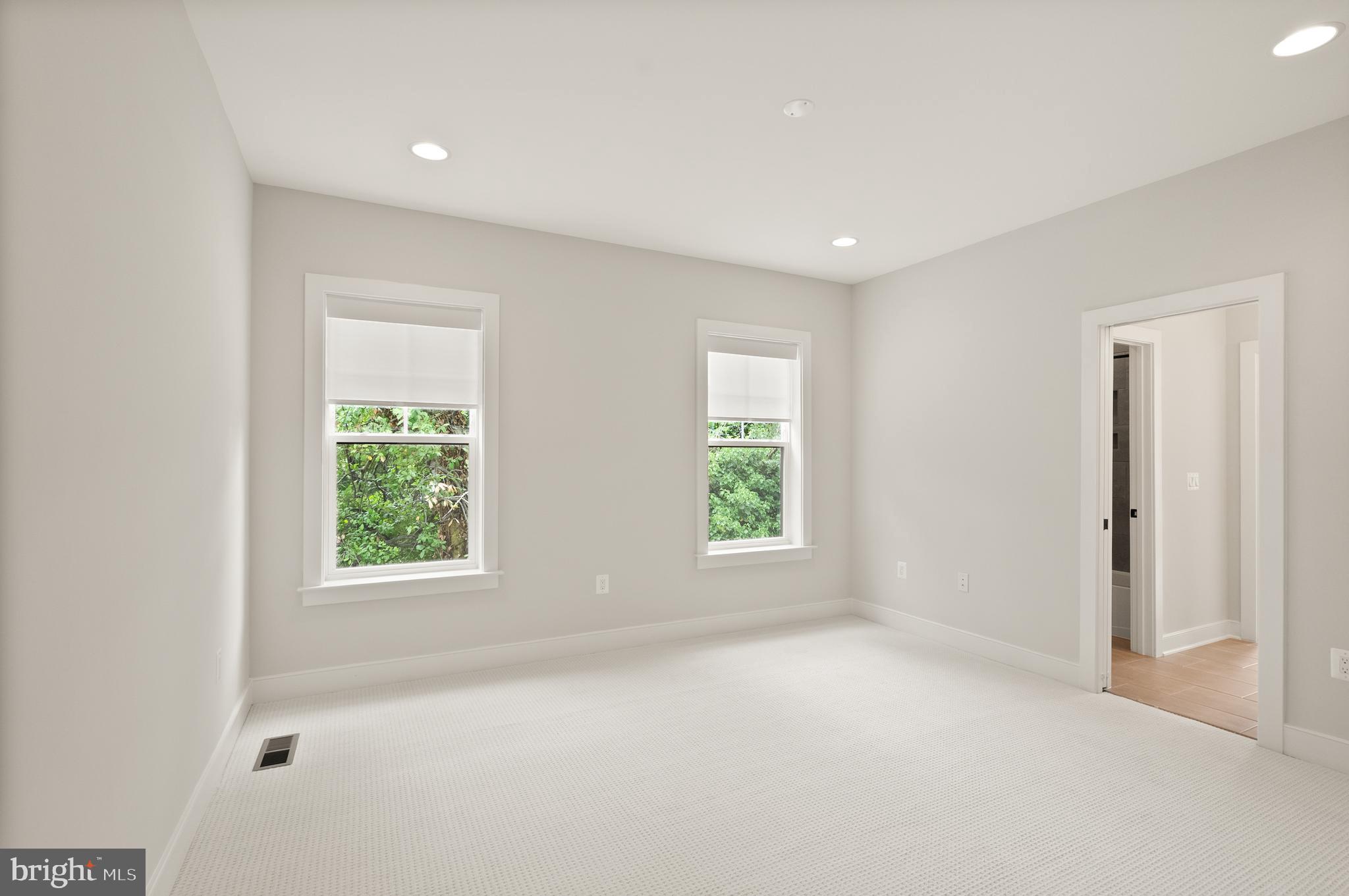 1212 Drake Street Southwest Vienna, VA 22180 - Photo 58 of 84 an empty room with windows and closet
