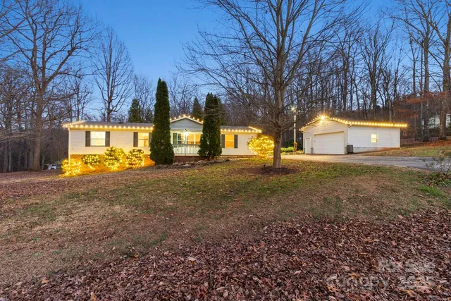 a view of a yard with a tree