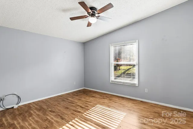 a view of a big room with windows