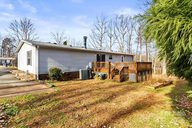 a view of a backyard with a large tree
