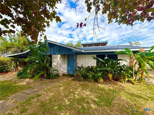 front view of a house with a big yard