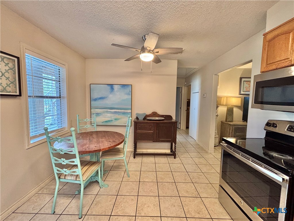 208 Washington Boulevard Port O'Connor, TX 77982 - Photo 14 of 47 a dining room with furniture and window