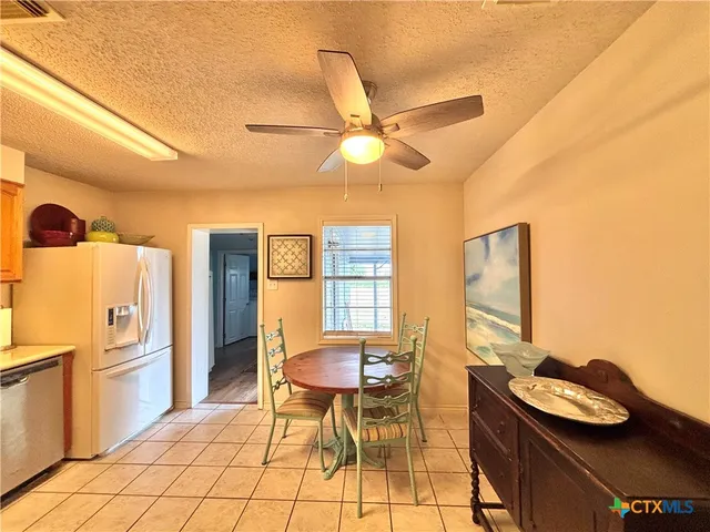 a view of a street with a building in the background