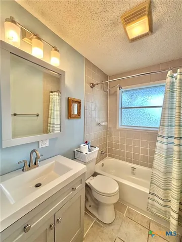 a bedroom with double bed and a window