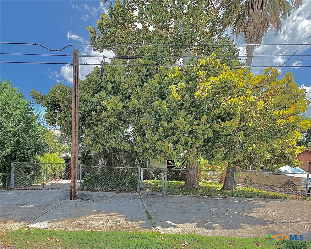 208 Washington Boulevard Port O'Connor, TX 77982 - Photo 32 of 47 a view of a street with palm trees