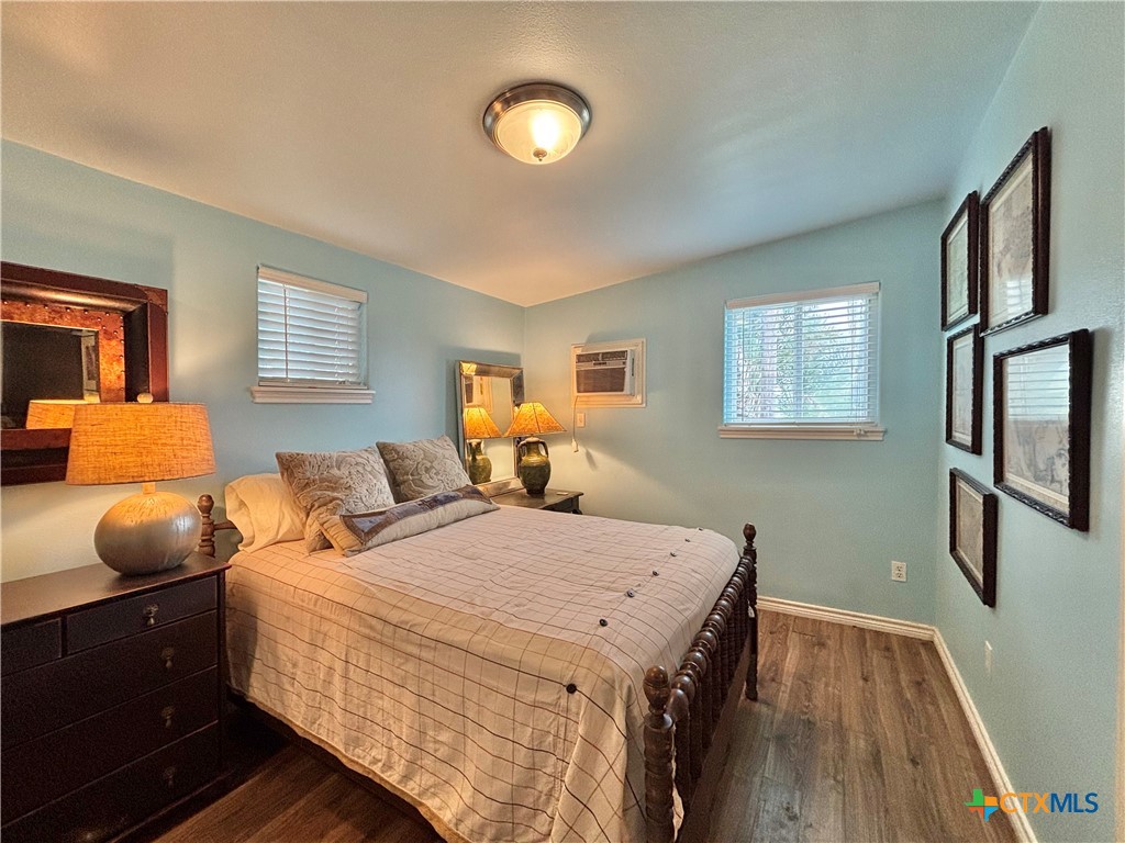 208 Washington Boulevard Port O'Connor, TX 77982 - Photo 44 of 47 a bedroom with double bed and a window
