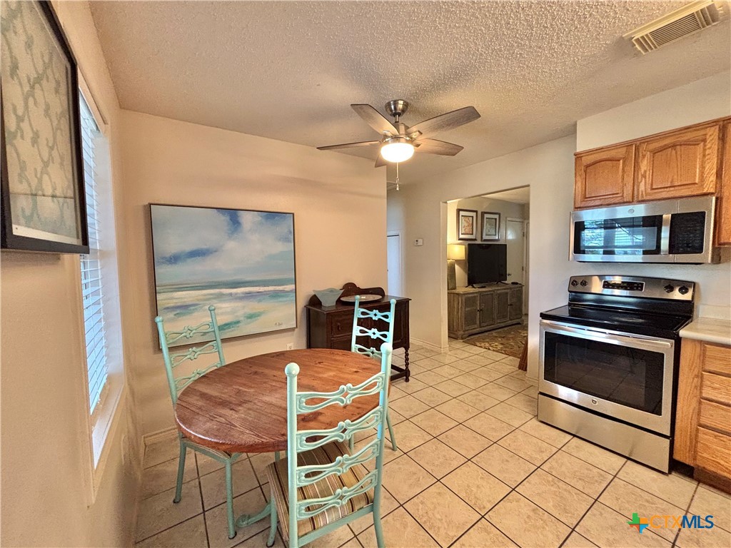 208 Washington Boulevard Port O'Connor, TX 77982 - Photo 7 of 47 a dining room with furniture and window