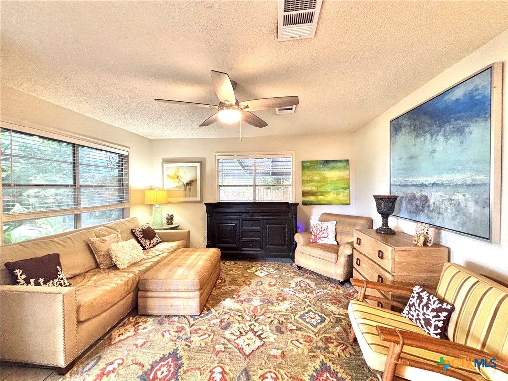 208 Washington Boulevard Port O'Connor, TX 77982 - Photo 9 of 47 a living room with furniture and a large window